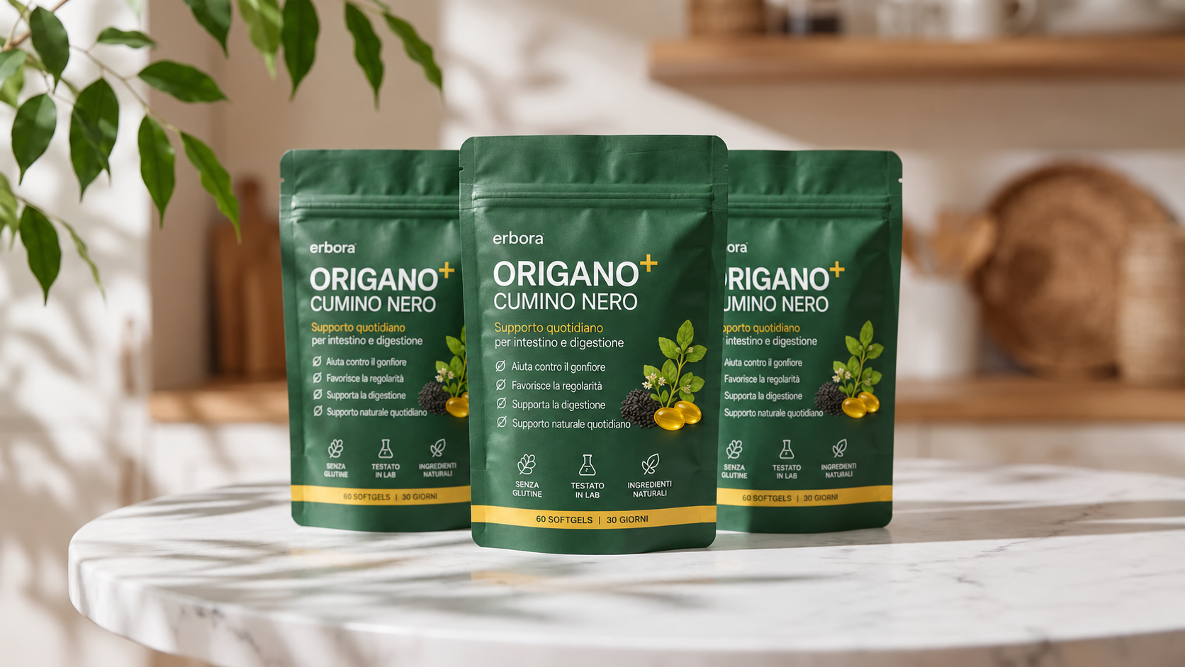 Confezione di Erbora Origano + Cumino Nero: tre bustine verde scuro con perle di olio su tavolo di marmo